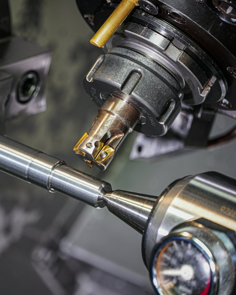 Metal bar being machined on a lathe